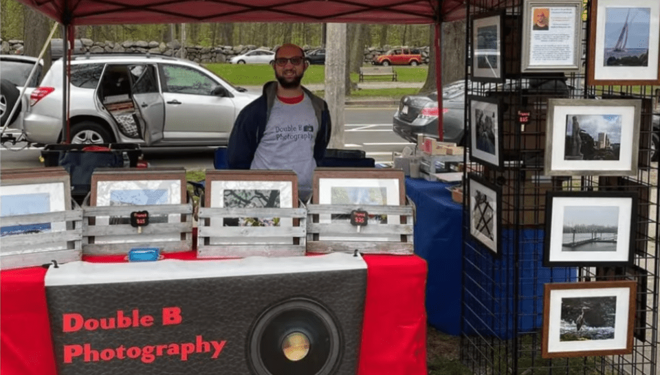 Bryan Baron at a booth selling his photos