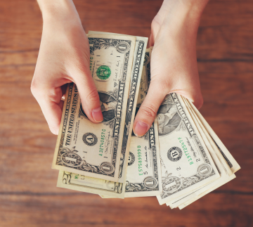 Hands holding money