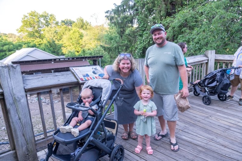 Parents and their children enjoy the zoo after the program.