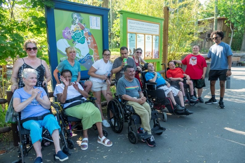 A group of guests poses inside the zoo.