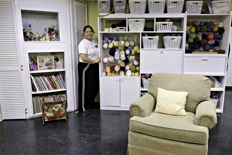 Valerie Gonzalez shows the yarn in a craft room a Sherlock Center grant helped fund.