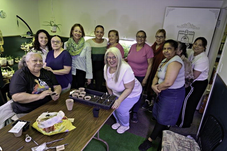 A group photo of those participating in planting.