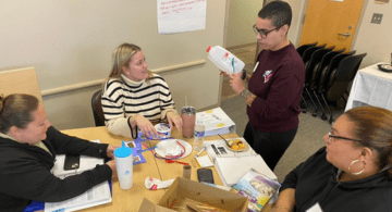 Four early intervention professionals create an activity out of household items during an EI training.