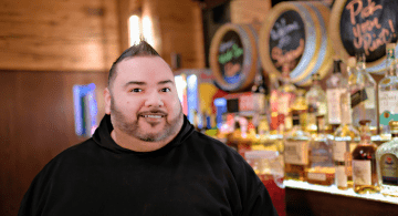 Edward Torres stands in a bar at Bally's Twin River.