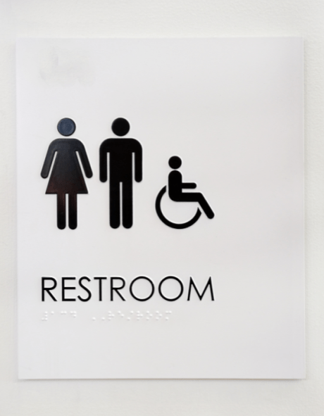 A sign indicating restrooms including an accessible option.