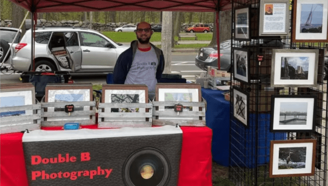 Bryan Baron at a booth selling his photos