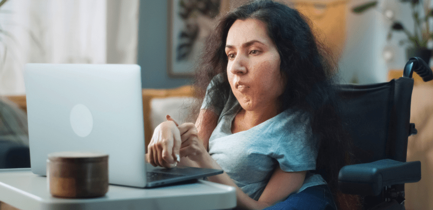 A person uses a laptop for work.
